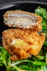 cutlet cordon bleu chicken meat, ham, cheese natural fresh appetizer meal food snack on the table copy space food background rustic top view