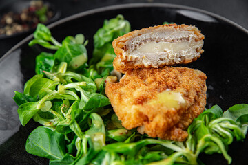cutlet cordon bleu chicken meat, ham, cheese natural fresh appetizer meal food snack on the table copy space food background rustic top view