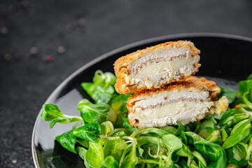 cutlet cordon bleu chicken meat, ham, cheese natural fresh appetizer meal food snack on the table copy space food background rustic top view