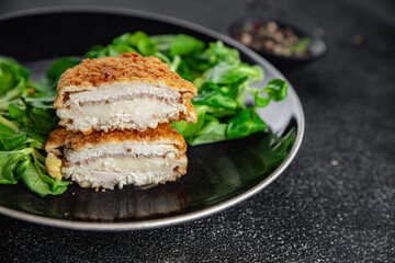 cutlet cordon bleu chicken meat, ham, cheese natural fresh appetizer meal food snack on the table...