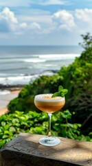 A refreshing cocktail with mint garnish on a seaside cliff