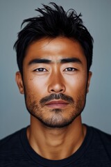 Fototapeta premium A man with a black shirt and a mustache.