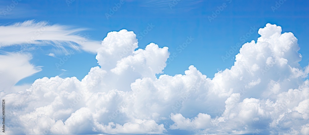 Aufkleber stock photo of a clear blue sky and fluffy clouds with copy space image.