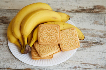 Cookies and bananas on a kitchen table, banana cookies, dessert with bananas
