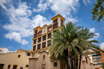 Facade of the church of the convent of Las Claras in Murcia, Spain, with its two towers, lattices...