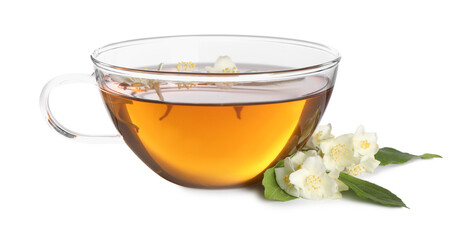 Aromatic jasmine tea in cup, flowers and green leaves isolated on white