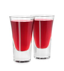 Shot glasses of delicious cherry liqueur isolated on white