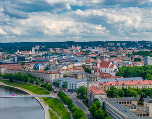 Naklejka premium Vilnius, Lithuania. Aerial view of old town, old town and city center next to Neris river and White bridge. Panoramic drone photo