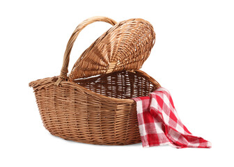 One open picnic wicker basket with checkered napkin isolated on white