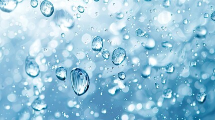 Clear water drops on a blue-white background There are soft waves when exposed to light, giving a refreshing feeling and blurring the softness of the water surface. 