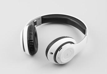 White wireless headphones isolated on white background. Monochrome. Black and white