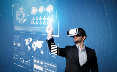 Skilled business man looking data analysis while planning strategy by using visual reality glasses....