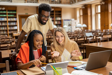 Group of young people working together and looking involved