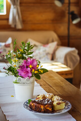 Table with flowers and cake