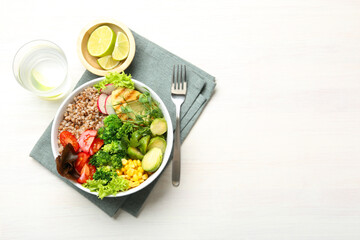 Healthy meal. Tasty products in bowl on white table, top view. Space for text