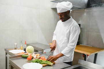 handsome african american chef at restaurant kitchen