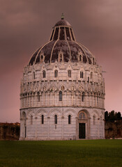 Battistero di San Giovani in Pisa with dark sky