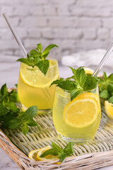 Fototapeta premium The Limoncello Spritz is a light, refreshing, cool cocktail made with lemon liqueur, prosecco and sparkling water, mint and a slice of lemon.