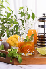 Mango iced tea with lime and mint has the perfect ratio of juice, tea and mint, sweetened with honey and so fresh and delicious. Prepare this summer refreshing organic soft drink.