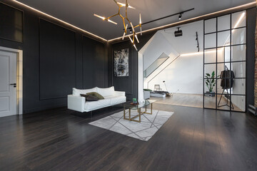 minimalistic stylish interior of luxury apartment with white stylish bedroom and dark living room....