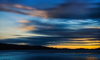 Obraz premium sunset over the river