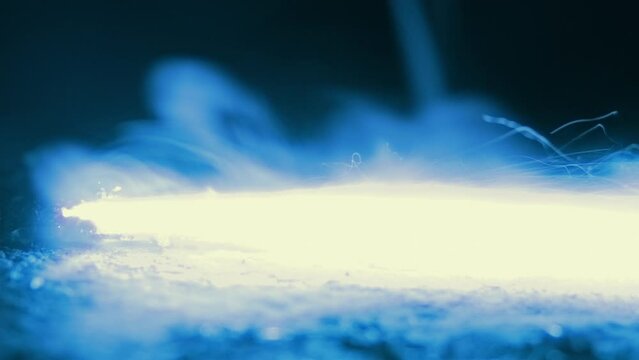 Industrial Fuse Burns Past In The Dark
