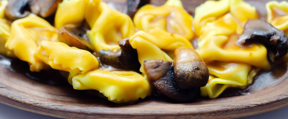 A plate of pasta with mushrooms and cheese