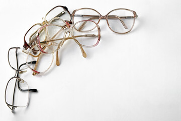 Frame of optical glasses with diopters laid out on a white background