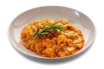 Potato and fennel stew in tomato sauce with rosemary sprig in white plate isolated