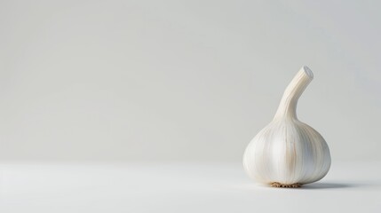 Single Garlic Clove on a White Background