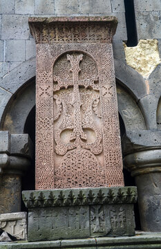 Stone khachkar also known as an Armenian cross stone adorned with detailed interlacing patterns. The craftsmanship reflects the rich cultural heritage and artistic traditions of Armenia