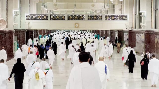 Mecca, Saudi Arabia - 18 FEB 2022 circa: Crowd of Muslim Pilgrims Walking on Saee Between Safa and Marwa