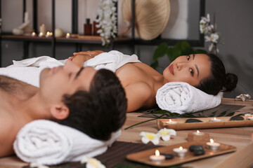 Young couple relaxing in spa salon