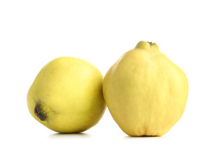 Fresh quinces on white background