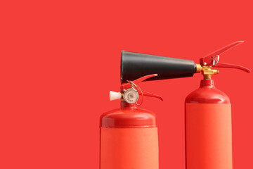 Fire extinguishers on red background