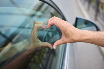 Allow yourself to feel a deep sense of love and connection while looking through the window of a car