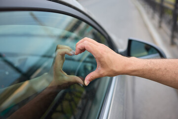 Allow yourself to feel a deep sense of love and connection while looking through the window of a car