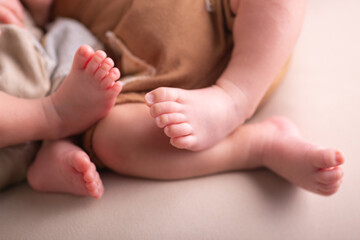 Little newborn baby human feet with toes and toenails close up