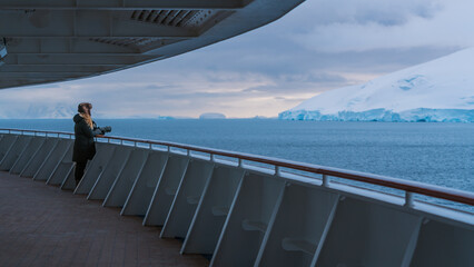 Epic Beautiful Female Photographer on Antarctica Cruise Ship Promenade Deck Holds Professional...