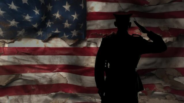 silhouettte soldier saluting dark ambiance of American torn and tattered flag waves in the wind.