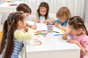 Fototapeta premium Group of children drawing at table indoors