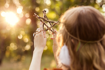 Young female shaman in forest