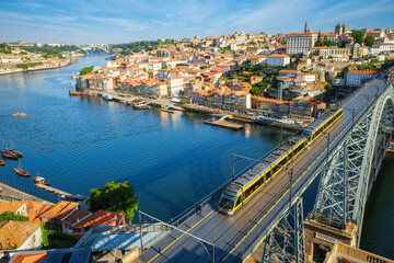 View of Porto city and Douro river and Dom Luis bridge I with metro tram from famous tourist...