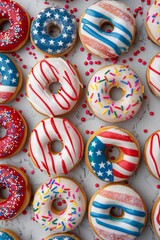Top view of different donuts with sprinkles on the white background. 4th of july themed donuts.