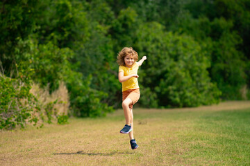 Morning running jogging with children. Child runner jogger running in the nature. Active healthy kids lifestyle. Sporty kid running in street. Sporty child boy runner running in park.