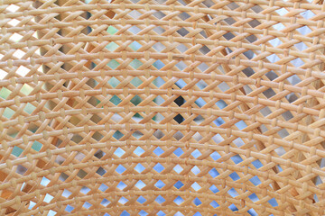 Woven bamboo rattan. Traditional handcraft weave Thai style pattern nature texture background.  Wicker surface for furniture material