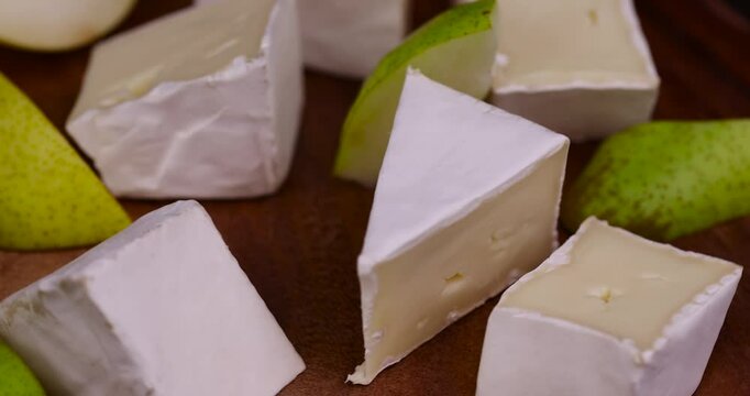 cheese with white mold cut into chunks , preparation of cheese with mold for use in cooking