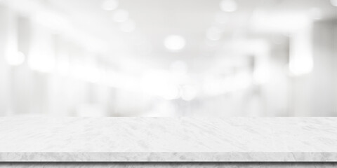 Empty white table top, counter, desk background over blur perspective bokeh light background, White marble stone table, shelf and blurred kitchen restaurant for food, product display mockup, template