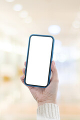 Woman hand holding black smart phone with blank screen for mock up background with copy space, template, technology and lifestyle