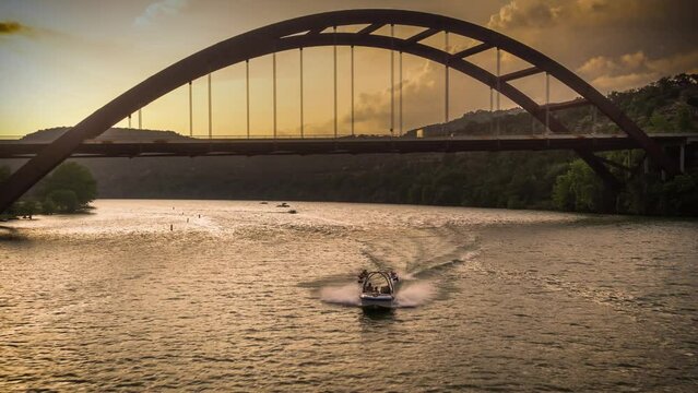 Austin 360 Bridge with boat at Sunset